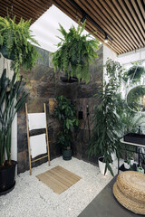 Shower in tropical bathroom with green plants