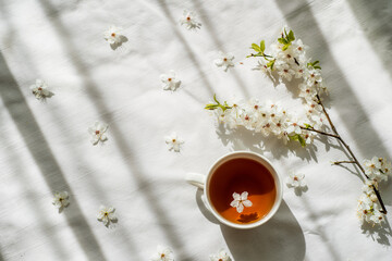 Colorful bright floral pattern with tea cup. Flat lay.