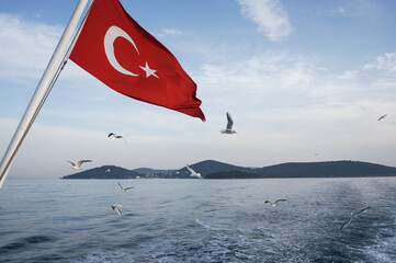 Boat trip on the Sea of ​​Marmara along the Princes' Islands near Istanbul. Turkish flag is...