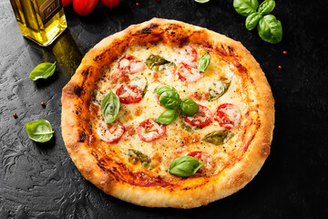 Fresh Homemade Italian Pizza Margherita with mozzarella cheese,cherry tomatoes and fresh  basil...
