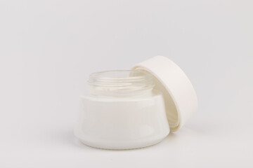 Beauty Cream Texture Close Up. Cosmetic Skincare Product In Jar On White Background. High Quality