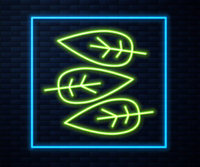 Glowing neon line Leaf icon isolated on brick wall background. Leaves sign. Fresh natural product symbol. Vector