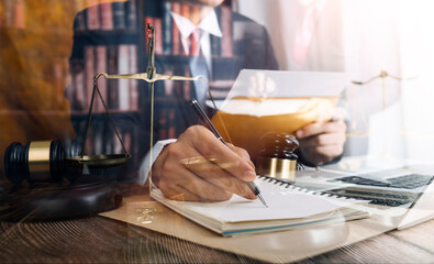 Business and lawyers discussing contract papers with brass scale on desk in office. Law, legal services, advice, justice and law concept picture with film grain effect