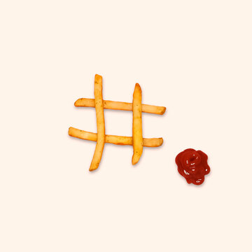 Hashtag sign icon with french fries on beige colour background. Social media concept. Food, nutrition, fries.