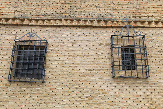 Detail of two windows with bars from the monastery of Santa Clara cloistered nunnery in the town of Carrion de los Condes, Palencia province, Spain