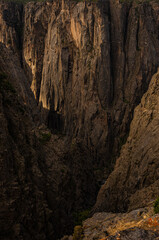 Fototapeta na wymiar Light Casts Over the Deep Canyon Walls