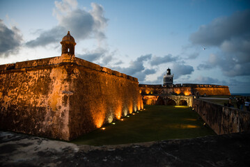 Castillo San Felipe del Morro of San Juan, Puerto Rico, a castle fortress at sunset. Generations of soldiers lived at the fort and visitors today are inspired by the stories and architecture. © Jess Yurinko Photo