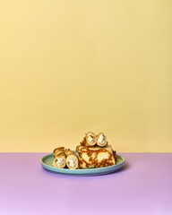 plate of pancakes with cottage cheese on a bright colored background.