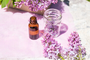 Obraz na płótnie Canvas Syringa (lilac), essential oil, composition with small flowers