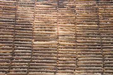 Log retaining wall background, with repetitive yet unique repetition, located in Victor, Colorado