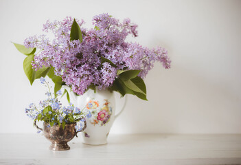 Vintage still life of lilac and forget-me-nots  flowers, Springtime