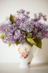 Vintage still life of lilac flowers, Springtime. Gentle floral muted garden flowers