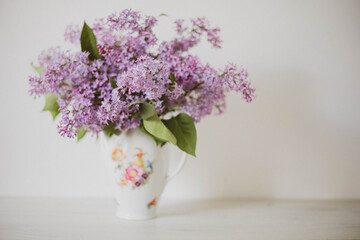 Vintage still life of lilac flowers, Springtime. Gentle floral muted garden flowers