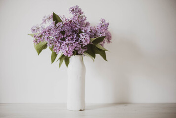Vintage still life of lilac flowers, Springtime. Gentle floral muted garden flowers