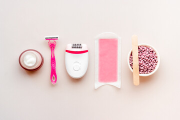 Flat lay of epilator with spa cosmetic treatments. Epilation concept