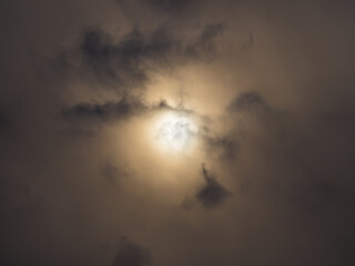 Dramatic sky, sun breaks through dark clouds