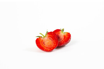 Two half of fresh strawberries isolated on white background