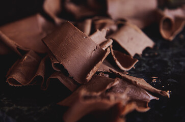 Closeup of collected cooled melted chocolate from marble table
