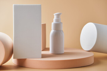 Trendy cosmetics tube on pedestal at the pink background.