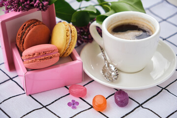 Macaroons on plate on a checkered tablecloth