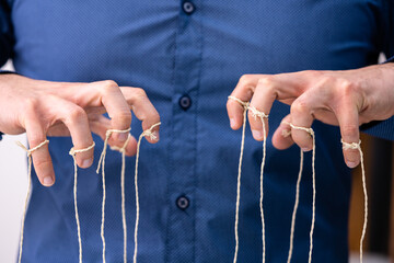 Manipulating Marionette Puppet Strings By Hand