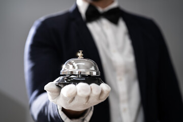 Hospitality Service Concierge In Uniforms With Butler Bell