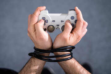 Video Game Addiction. Wire and Gamepad