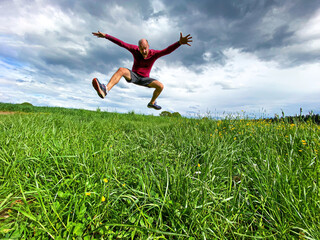 Running Sport Man in free Spring nature enviornment with pure fun