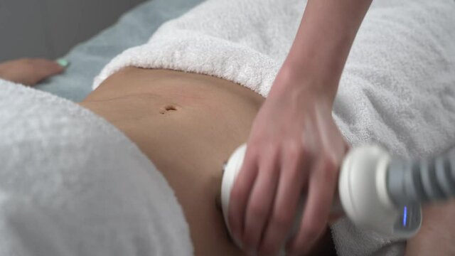 Close up of professional cosmetologist taking a nozzle for vacuum massage