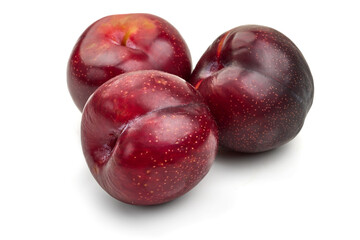 Fresh red plums, isolated on white background. High resolution image.