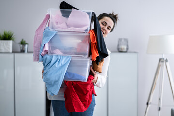 Woman Decluttering And Doing Laundry