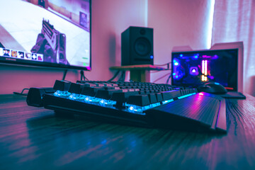 Modern gamer setup with keyboard and hardware with Leds with Counter Strike on the monitor © Naturestock