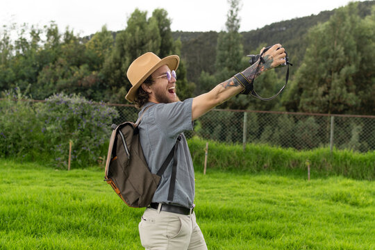 travel blogger with camera glasses and backpack in nature with a happy expression