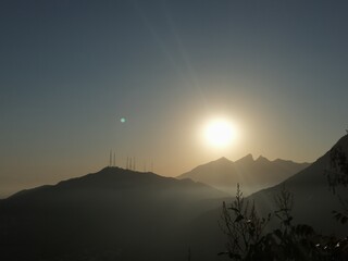 The sun rising above an iconic mountain from Monterrey, MX, known as "El Cerro de la Silla"
