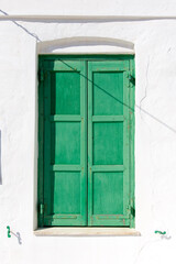 green window on a wall