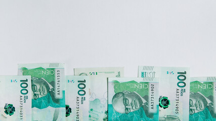 colombian money, one hundred thousand pesos on white background