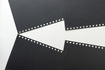 black coil or spiral notebook paper arranged on white