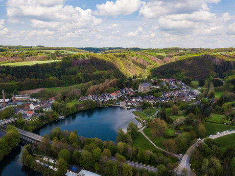 Aerial view of the monastery church Sankt Maria Magdalena in Wuppertal Beyenburg located behind the Beyenburger reservoir.