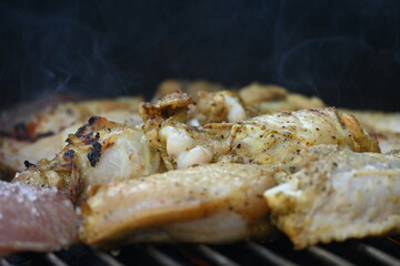 Grilling chicken in a summer barbeque	
