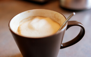 Mug with coffee and milk foam