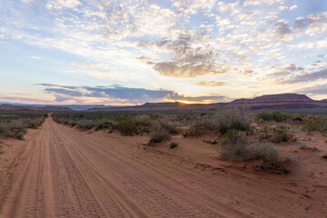 Dirt road at sunset in Utah desert