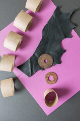 abstract retro 1980s or 1990s composition with magenta-pink paper, on dark grey mat board -...