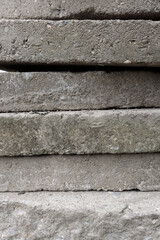 Sidewalk stone slabs stacked on top of each other