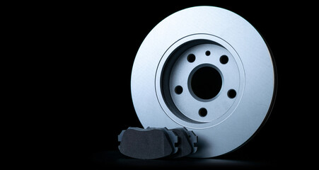 Mechanic part. New metal car part. Auto motor mechanic spare or automotive piece isolated on black background. Automobile engine service with space for text.