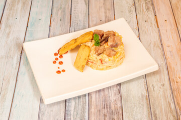 Russian salad with boiled egg, mackerel, croutons, grated tomato, red pepper, mayonnaise, carrot,...