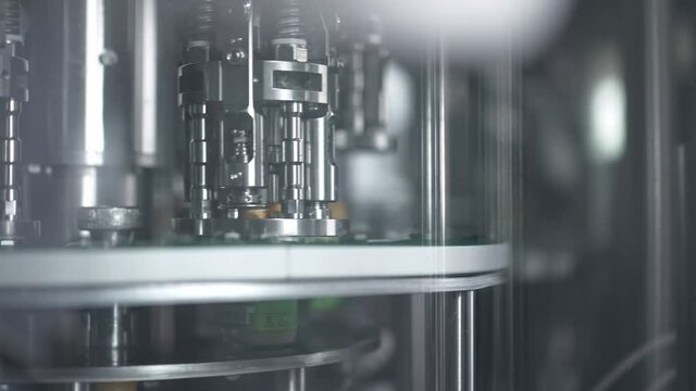 Robotic automation line. packaging warehouse, processing facility.
Glass bottles on conveyor belt in beverage factory. smart factory automation. industry 4.0
