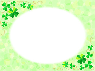 四つ葉と三つ葉のクローバーと緑色のふんわり水玉背景に白い円形のフレーム
