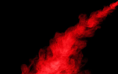 Close-up of red smoke with spray from a humidifier. Isolated on black background
