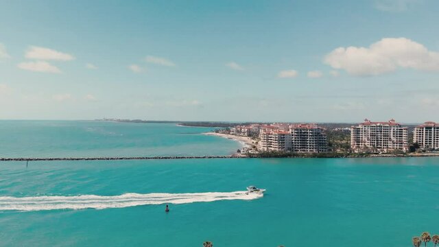 Amazing aerial view of Miami Beach coastline from drone on a sunny day, slow motion