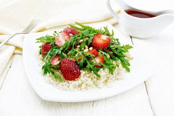 Salad of strawberry and couscous on white board